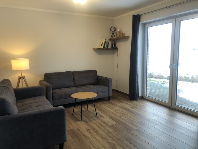 Ferienhaus in Fehmarn OT Gammendorf - Feriendomizil SeeSand - offener Wohnbereich mit Blick auf die Terrasse